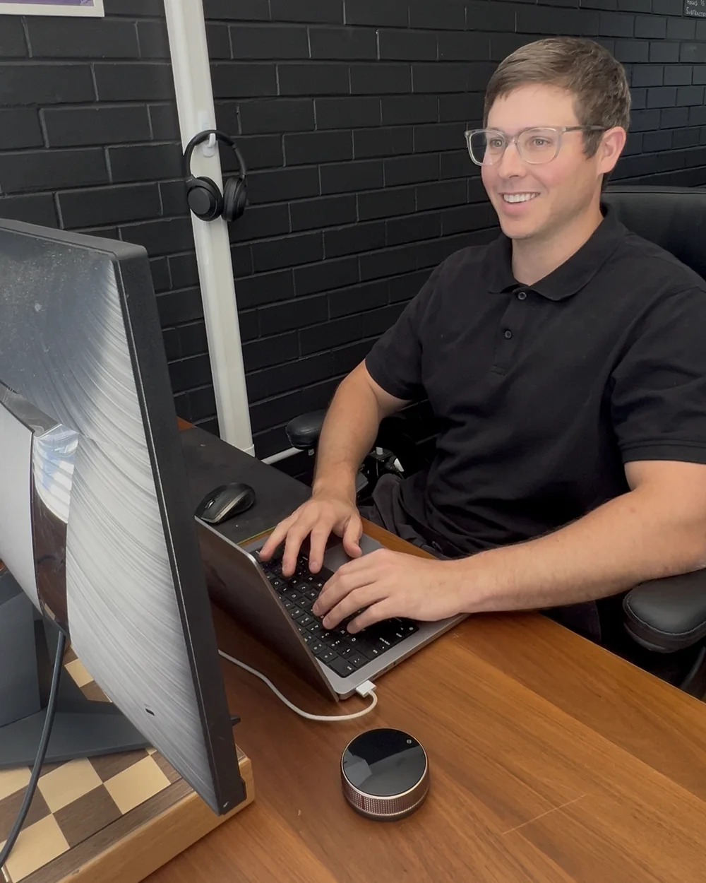 Ryan at his desk, building a website